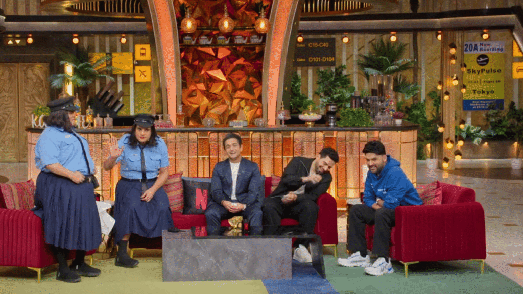 Comedy skit with cast members in police uniforms on The Great Indian Kapil Show Season 4 Netflix 2026 at Kap's Cafe set
