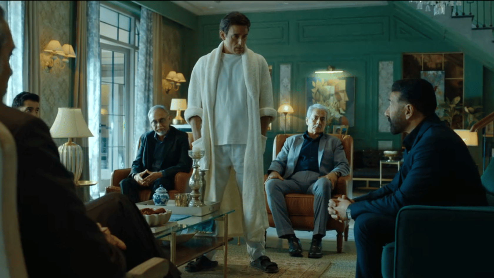 Akshaye Khanna as Shauryaman Gaur standing in his luxury mansion confronting Sunny Deol as Arjun Mehra in Ikka movie Netflix 2026