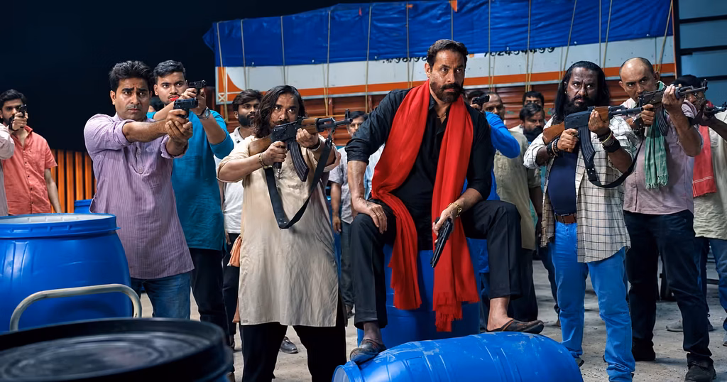 Ravi Kishan and Vishal Jethwa with armed gang members in a tense warehouse standoff scene from Clean Up Company.
