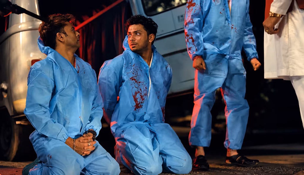 Vishal Jethwa and Amey Wagh in blood-stained protective suits during a tense crime scene from Clean Up Company.